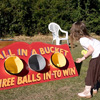 Lola putting balls in buckets at Ruskin Park fun day